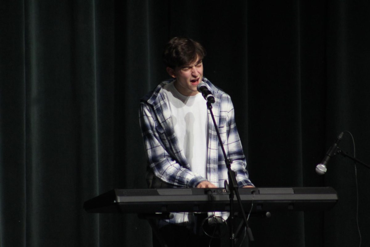 Carter Sullivan played piano and and sang for his act.  