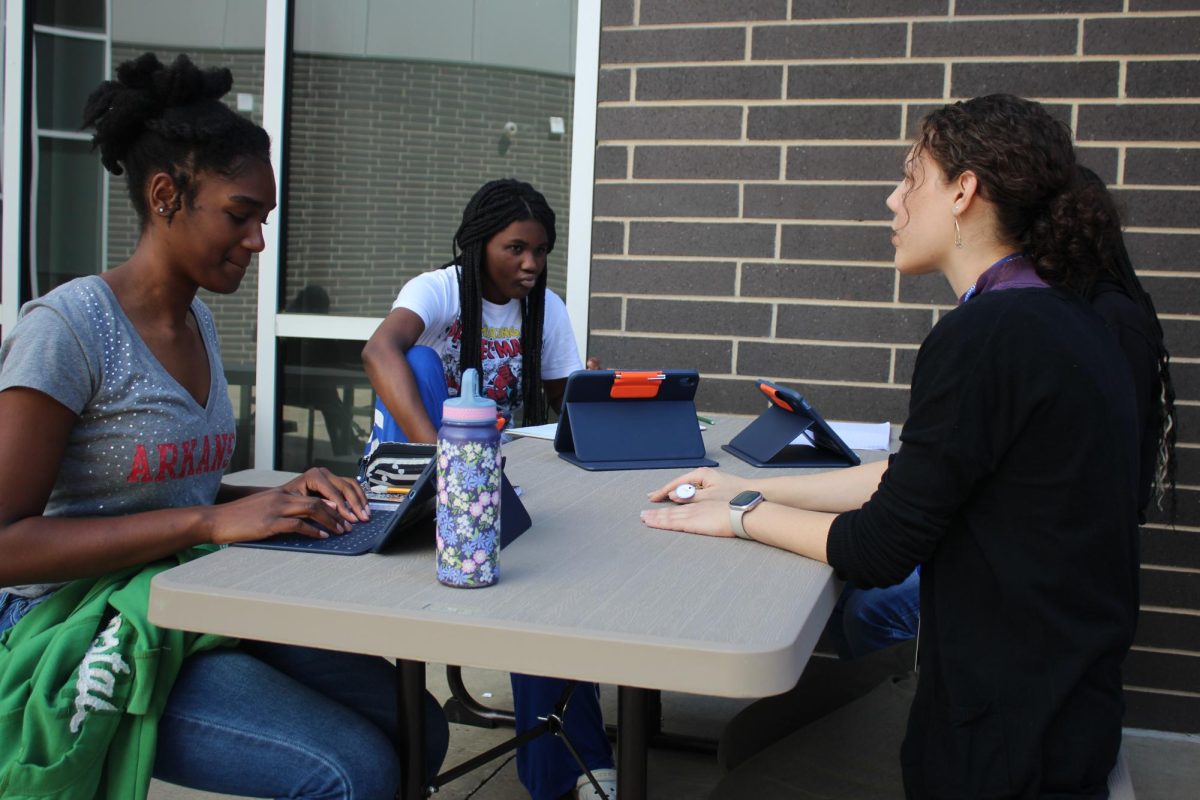 Rachel Sweningson’s freshman creative writing students, Mykah Colclough and ZaLayiah Kertis-Jones, are in the new courtyard discussing ideas on poems to write. 