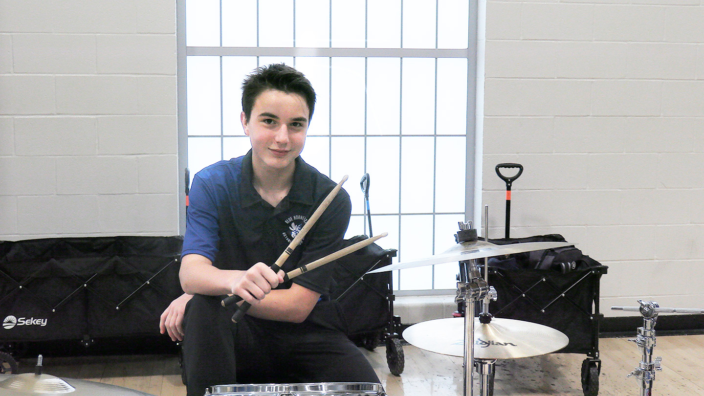 Canaan Jones, 9, takes a break from drumming during the November pep rally.
